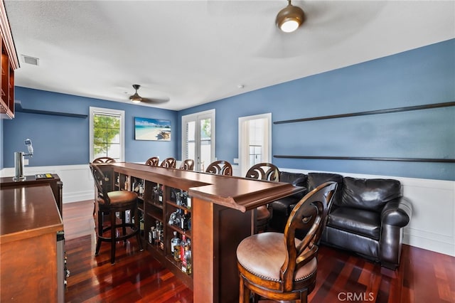 1 Tularosa Ct, Aliso Viejo, CA 92656 - dining space featuring a ceiling fan, wood finished floors, and a wainscoted wall