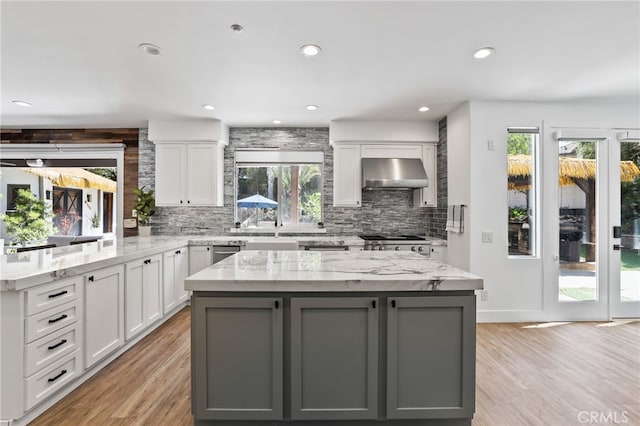 1 Tularosa Ct, Aliso Viejo, CA 92656 - kitchen featuring ventilation hood, gray cabinets, backsplash, light wood-style flooring, and recessed lighting