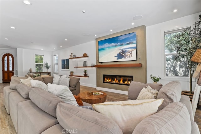 1 Tularosa Ct, Aliso Viejo, CA 92656 - living room featuring a glass covered fireplace, recessed lighting, and light wood-style floors
