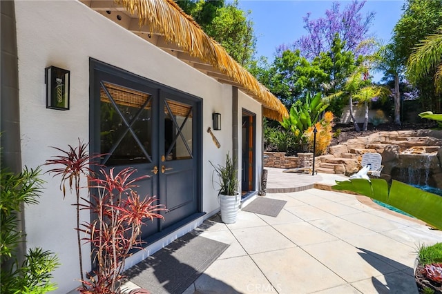 1 Tularosa Ct, Aliso Viejo, CA 92656 - doorway to property with stucco siding, a patio area, and french doors
