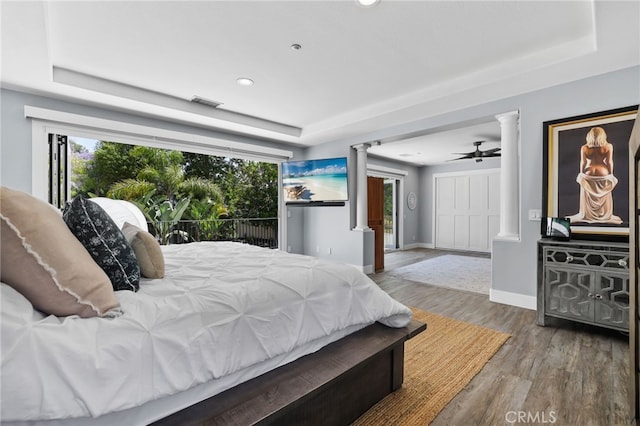 1 Tularosa Ct, Aliso Viejo, CA 92656 - bedroom featuring decorative columns, a raised ceiling, wood finished floors, and recessed lighting