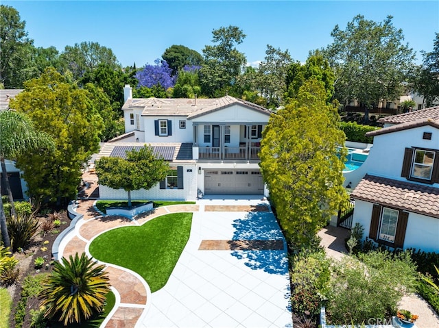 1 Tularosa Ct, Aliso Viejo, CA 92656 - view of front of house featuring an attached garage, a tile roof, concrete driveway, a chimney, and stucco siding