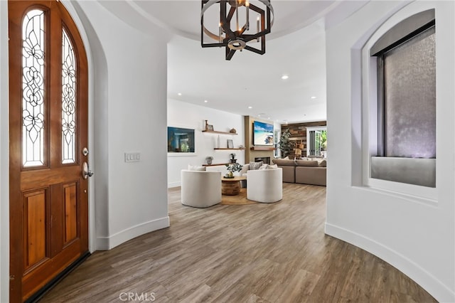 1 Tularosa Ct, Aliso Viejo, CA 92656 - entrance foyer featuring wood finished floors, a chandelier, arched walkways, and recessed lighting
