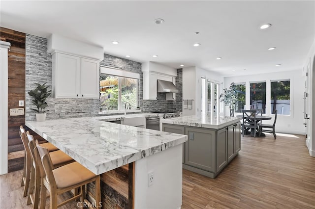 1 Tularosa Ct, Aliso Viejo, CA 92656 - kitchen with exhaust hood, gray cabinets, a center island, healthy amount of natural light, and recessed lighting