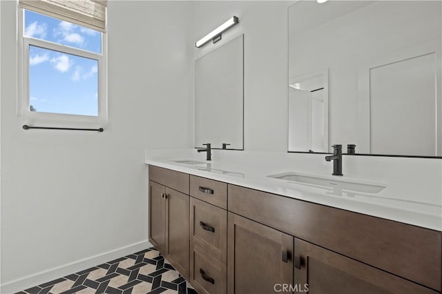 1080 Foothill Blvd, Claremont, CA 91711 - bathroom featuring baseboards and double vanity
