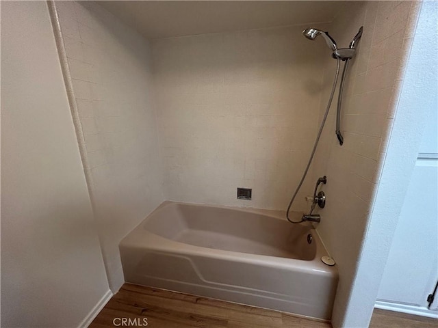 911 Ronda Sevilla Unit D, Laguna Woods, CA 92637 - bathroom featuring wood finished floors and washtub / shower combination