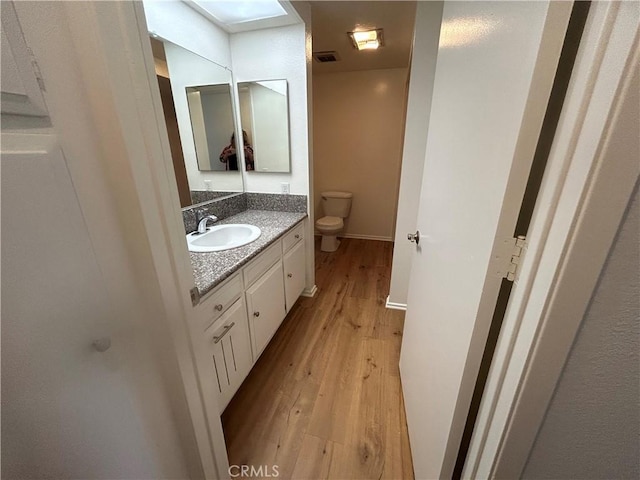 911 Ronda Sevilla Unit D, Laguna Woods, CA 92637 - bathroom featuring vanity and wood finished floors