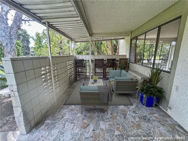 911 Ronda Sevilla Unit D, Laguna Woods, CA 92637 - view of patio / terrace featuring an outdoor living space