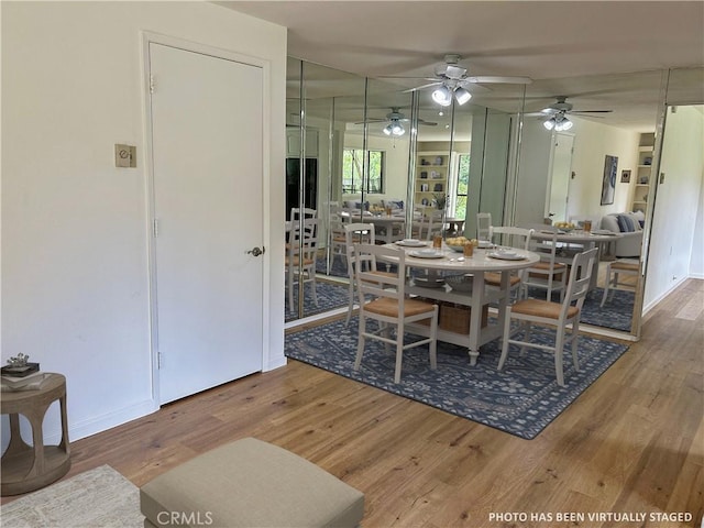 911 Ronda Sevilla Unit D, Laguna Woods, CA 92637 - dining space with ceiling fan and wood finished floors