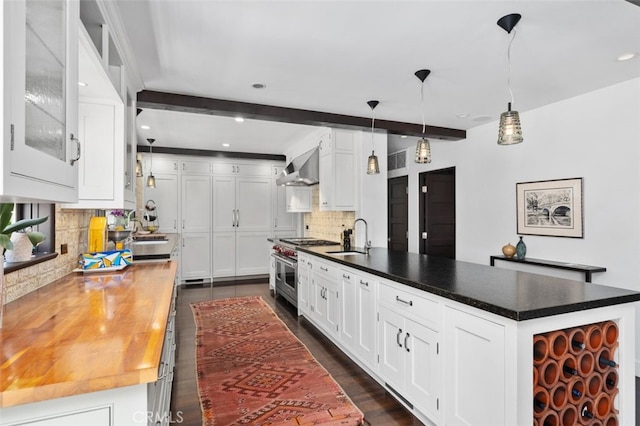 282 Argonne Ave, Long Beach, CA 90803 - kitchen featuring double oven range, wall chimney range hood, tasteful backsplash, white cabinetry, and beamed ceiling