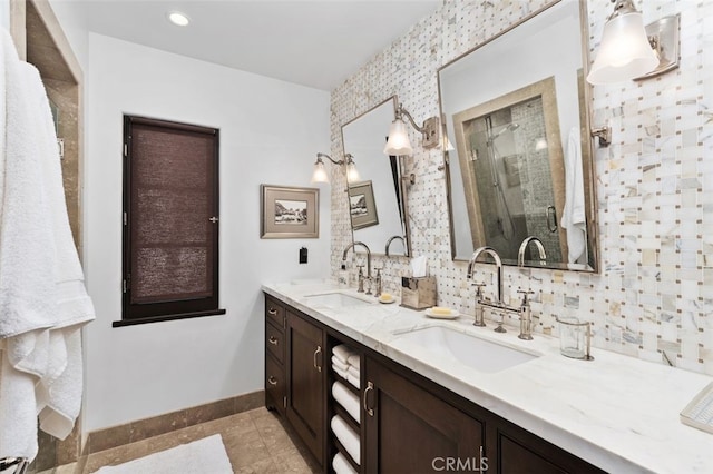 282 Argonne Ave, Long Beach, CA 90803 - bathroom featuring double vanity, a shower stall, tile patterned flooring, and backsplash