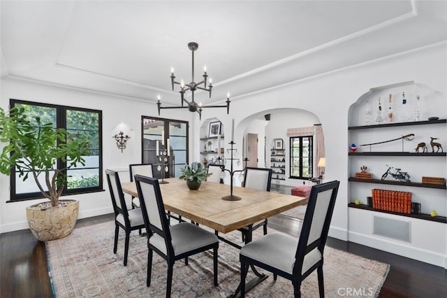 282 Argonne Ave, Long Beach, CA 90803 - dining area with a tray ceiling, arched walkways, wood finished floors, and a chandelier