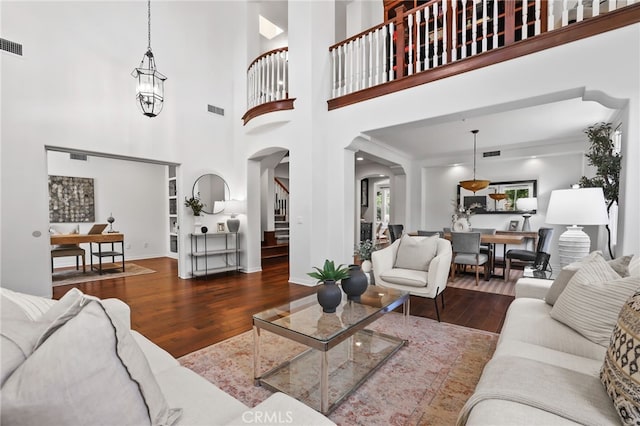 11 Heartwood Way, Aliso Viejo, CA 92656 - living room with arched walkways and wood finished floors