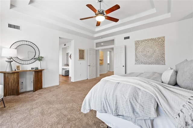 11 Heartwood Way, Aliso Viejo, CA 92656 - bedroom featuring a tray ceiling, carpet, ensuite bathroom, and ceiling fan