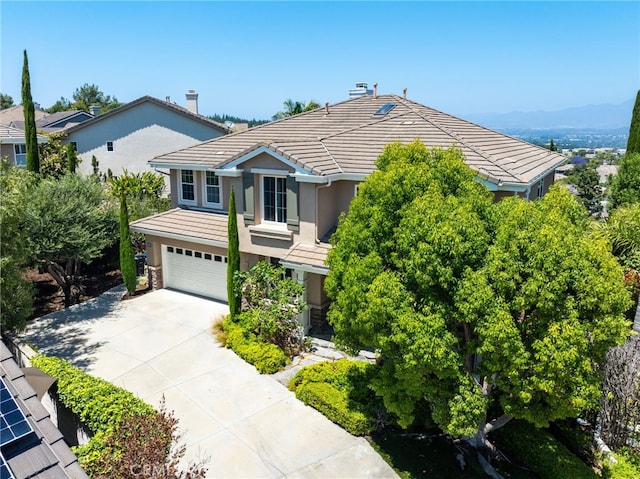 11 Heartwood Way, Aliso Viejo, CA 92656 - view of front of house with a garage, concrete driveway, stucco siding, and a tile roof
