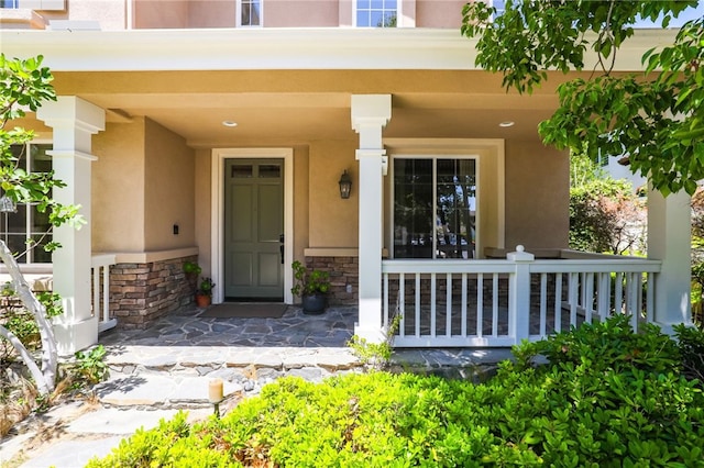 11 Heartwood Way, Aliso Viejo, CA 92656 - view of exterior entry with covered porch, stucco siding, and stone siding