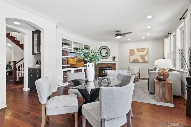 11 Heartwood Way, Aliso Viejo, CA 92656 - dining area featuring a ceiling fan, wood-type flooring, stairway, a stone fireplace, and recessed lighting