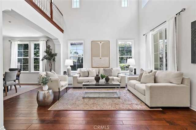 11 Heartwood Way, Aliso Viejo, CA 92656 - living area featuring dark wood finished floors, plenty of natural light, and a towering ceiling