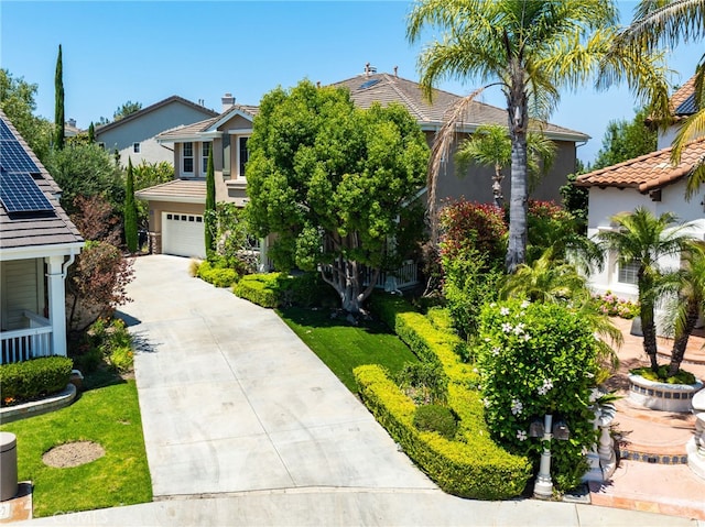 11 Heartwood Way, Aliso Viejo, CA 92656 - obstructed view of property featuring driveway, stucco siding, an attached garage, and a tile roof