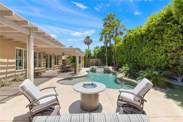 79787 Parkway Esplanade N, La Quinta, CA 92253 - view of pool featuring a pergola, a patio, a pool with connected hot tub, and a fenced backyard