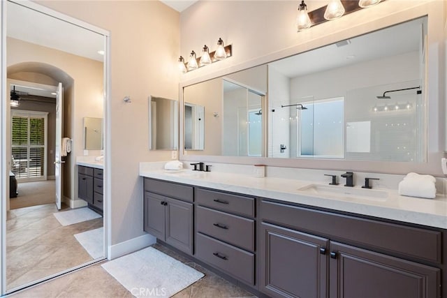79787 Parkway Esplanade N, La Quinta, CA 92253 - full bath with double vanity, walk in shower, tile patterned floors, and ceiling fan