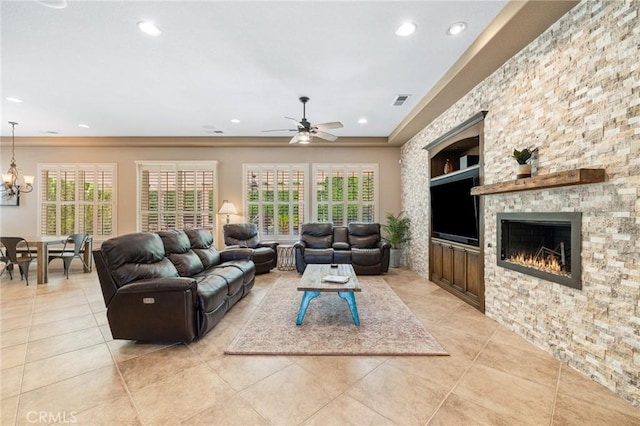 79787 Parkway Esplanade N, La Quinta, CA 92253 - living area featuring built in features, light tile patterned flooring, recessed lighting, ceiling fan, and a stone fireplace