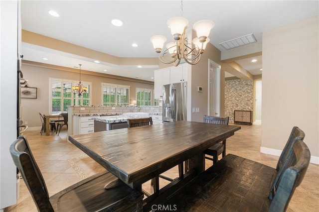 79787 Parkway Esplanade N, La Quinta, CA 92253 - dining space featuring a chandelier, light tile patterned floors, recessed lighting, and plenty of natural light