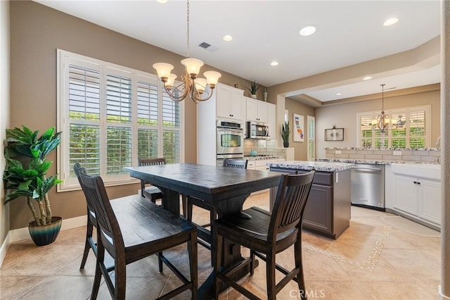 79787 Parkway Esplanade N, La Quinta, CA 92253 - dining area featuring a chandelier, recessed lighting, and light tile patterned floors