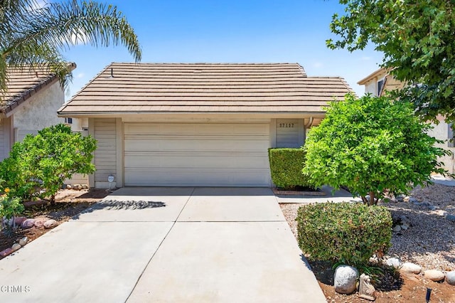 27127 Rio Bosque Dr, Valencia, CA 91354 - view of front of house featuring a tiled roof and concrete driveway