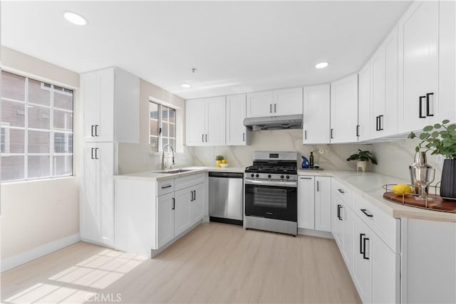 150 Diamond St Unit B, Arcadia, CA 91006 - kitchen featuring appliances with stainless steel finishes, under cabinet range hood, light wood-style floors, white cabinets, and recessed lighting