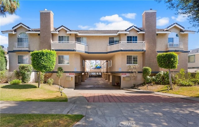 150 Diamond St Unit B, Arcadia, CA 91006 - view of front of property featuring a chimney, stucco siding, and a carport