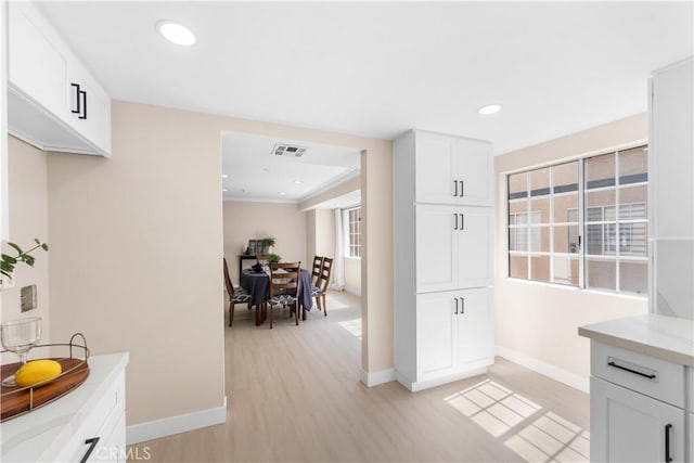 150 Diamond St Unit B, Arcadia, CA 91006 - kitchen with light wood-type flooring, white cabinetry, light stone countertops, and recessed lighting