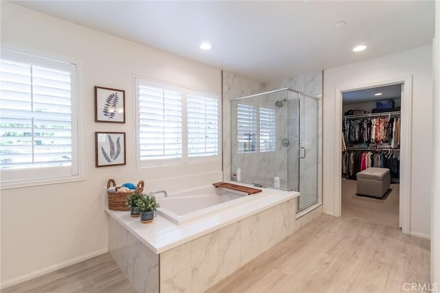1827 Montecito Ln, Redlands, CA 92374 - full bathroom featuring a garden tub, a shower stall, wood finished floors, a spacious closet, and recessed lighting