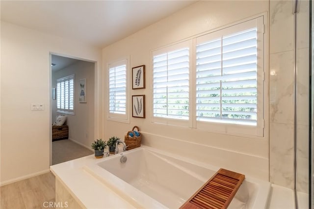 1827 Montecito Ln, Redlands, CA 92374 - full bathroom featuring a garden tub and wood finished floors