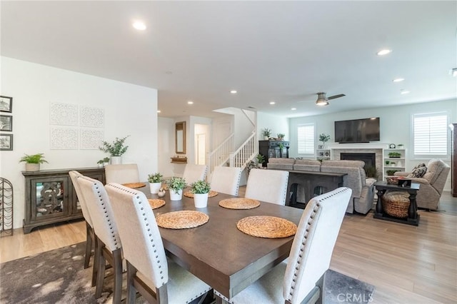 1827 Montecito Ln, Redlands, CA 92374 - dining space with stairs, plenty of natural light, recessed lighting, light wood finished floors, and a fireplace