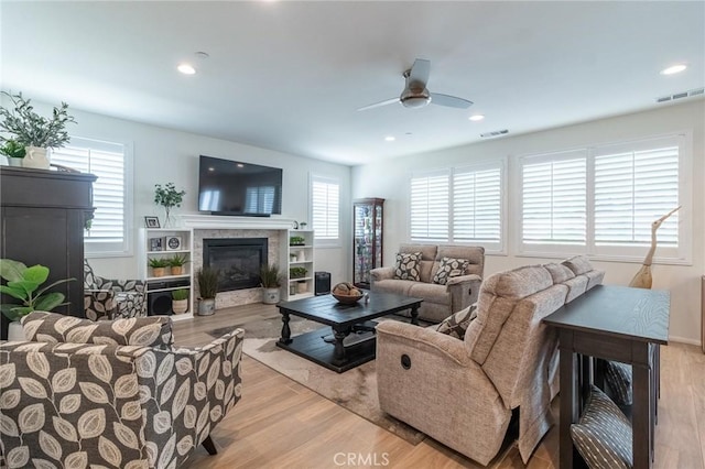 1827 Montecito Ln, Redlands, CA 92374 - living room with light wood-type flooring, a fireplace, ceiling fan, and recessed lighting