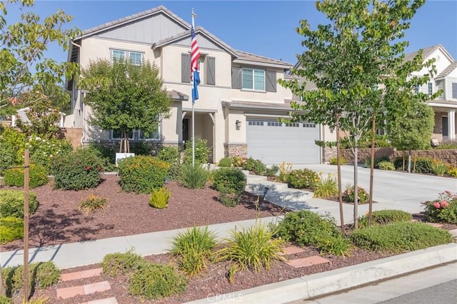 1827 Montecito Ln, Redlands, CA 92374 - view of front of home with concrete driveway, stucco siding, stone siding, and an attached garage