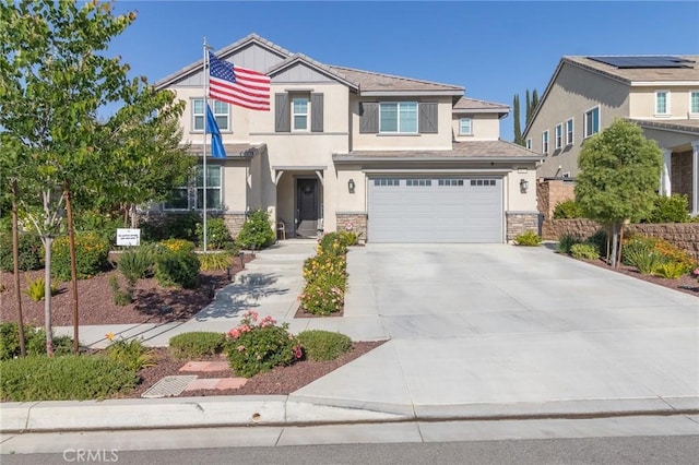 1827 Montecito Ln, Redlands, CA 92374 - view of front facade with stucco siding, stone siding, driveway, and an attached garage