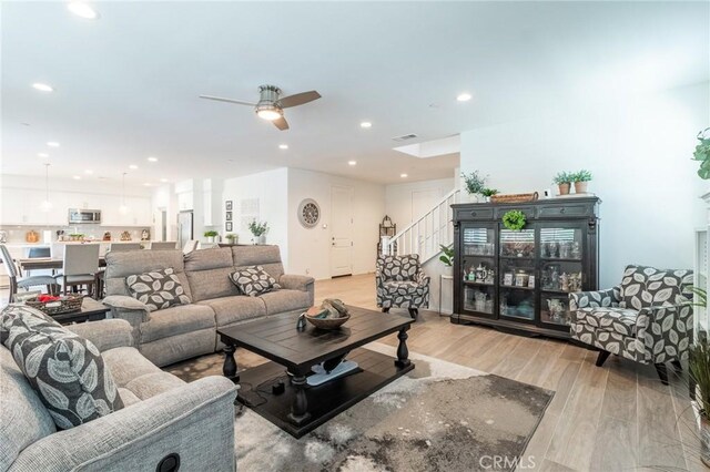 1827 Montecito Ln, Redlands, CA 92374 - living room featuring light wood finished floors, a ceiling fan, stairs, and recessed lighting