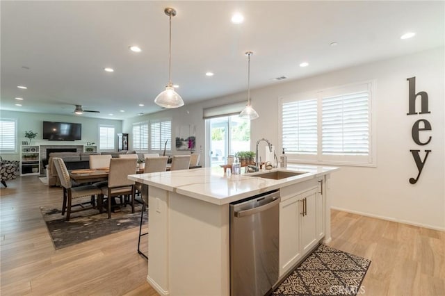 1827 Montecito Ln, Redlands, CA 92374 - kitchen with dishwasher, white cabinets, ceiling fan, light wood-style floors, and recessed lighting