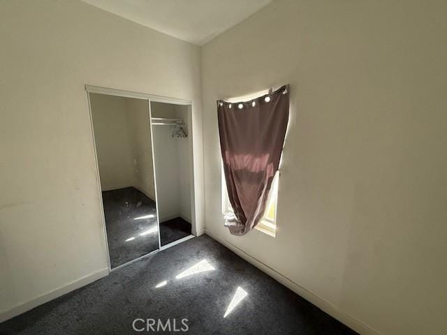 647 E 38th St, Los Angeles, CA 90011 - unfurnished bedroom featuring carpet and a closet