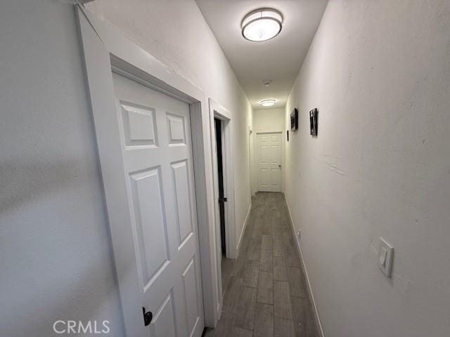 647 E 38th St, Los Angeles, CA 90011 - hallway with dark wood finished floors