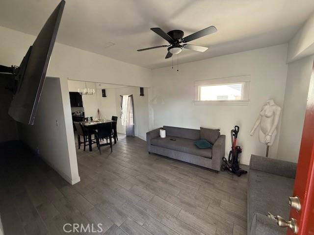 647 E 38th St, Los Angeles, CA 90011 - living area with ceiling fan, wood finished floors, and a chandelier