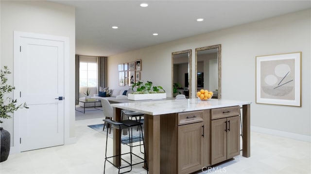 22325 Sage Ct, Torrance, CA 90502 - kitchen with a breakfast bar area, open floor plan, light floors, recessed lighting, and a center island