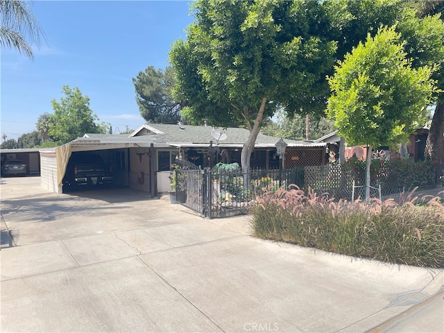 9413 Garfield St, Riverside, CA 92503 - ranch-style home with concrete driveway and a carport