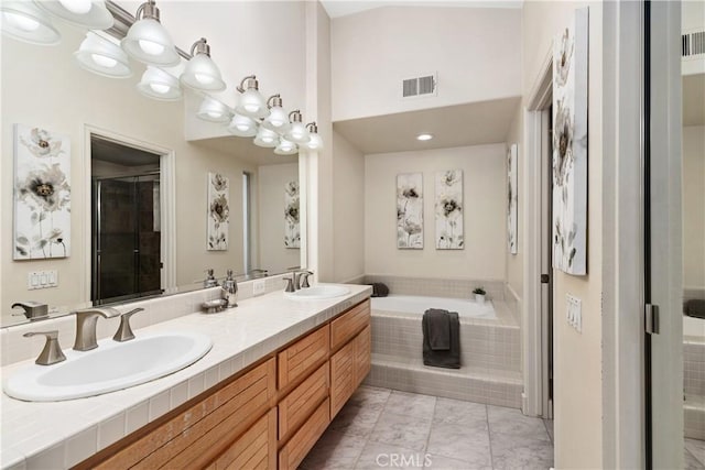 331 Parsons Lndg, Long Beach, CA 90803 - bathroom with a bath, double vanity, a shower with door, and tile patterned floors