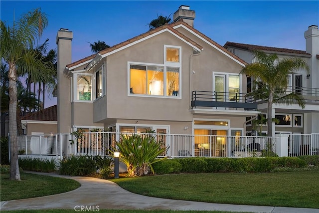 331 Parsons Lndg, Long Beach, CA 90803 - rear view of house featuring a chimney, a balcony, and stucco siding