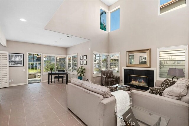 331 Parsons Lndg, Long Beach, CA 90803 - living area with a high end fireplace, tile patterned flooring, recessed lighting, and a high ceiling