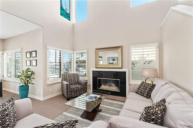 331 Parsons Lndg, Long Beach, CA 90803 - tiled living area with a glass covered fireplace and a towering ceiling