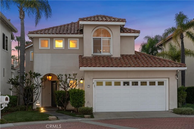 331 Parsons Lndg, Long Beach, CA 90803 - mediterranean / spanish house with a tiled roof, driveway, stucco siding, and a garage